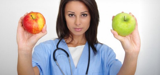 female-doctor-holding-two-apples